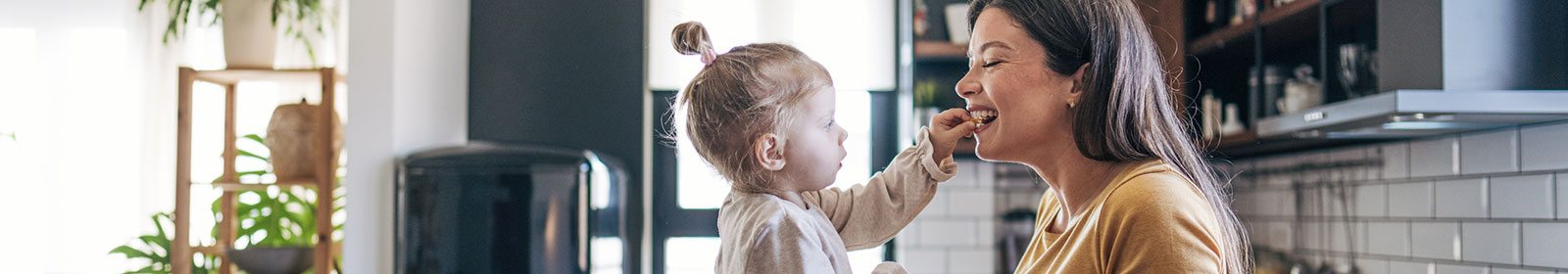 A mother and daughter playing in their home