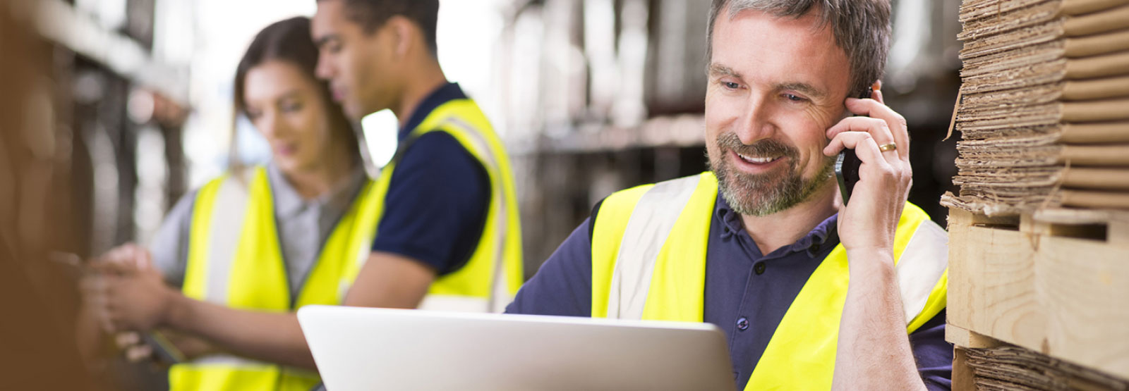 Employees working together in an industrial warehouse